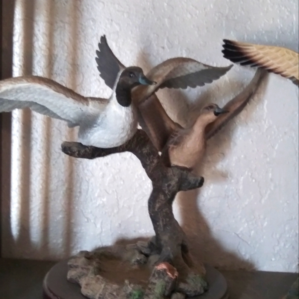This beautiful piece of two ducks taking flight